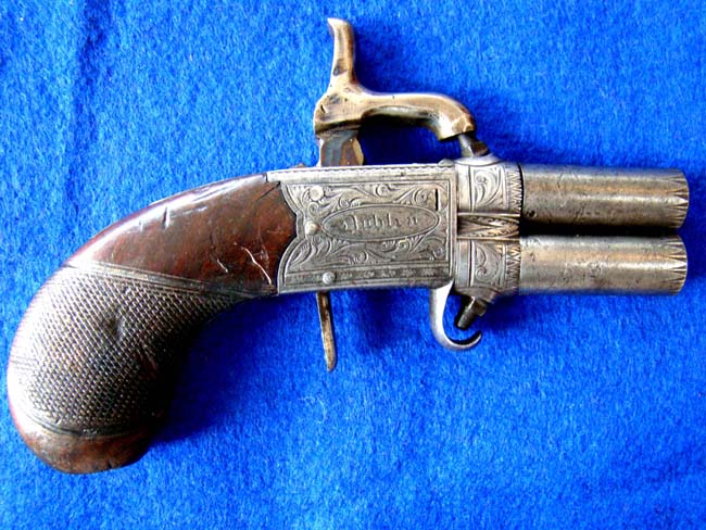 An Irish .38 cal. Percussion pocket pistol with swivel barrels made by Rigby of Dublin circa 1845